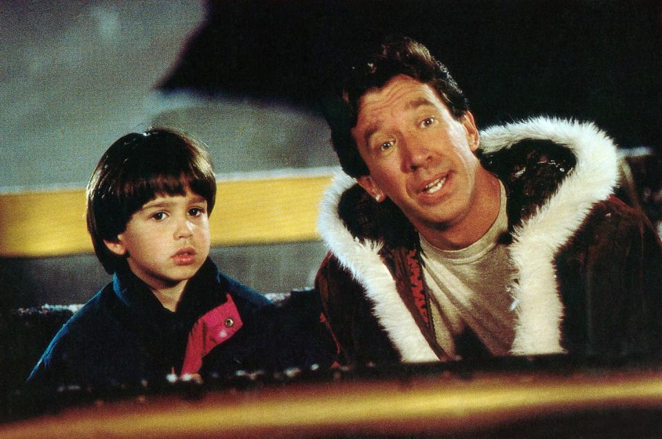 <p> After unintentionally killing a man in a Santa suit on Christmas Eve, businessman Scott Calvin is informed by elves that he's now obligated to take over the role of Santa. Calvin (Tim Allen) processes this news comically throughout the movie as, slowly but surely, his hair gets whiter and his waistline gets larger.</p><p><a class="link " href="https://www.amazon.com/dp/B003QSI7X0?tag=syn-yahoo-20&ascsubtag=%5Bartid%7C10070.g.58%5Bsrc%7Cyahoo-us" rel="nofollow noopener" target="_blank" data-ylk="slk:Shop Now;elm:context_link;itc:0;sec:content-canvas">Shop Now</a></p>