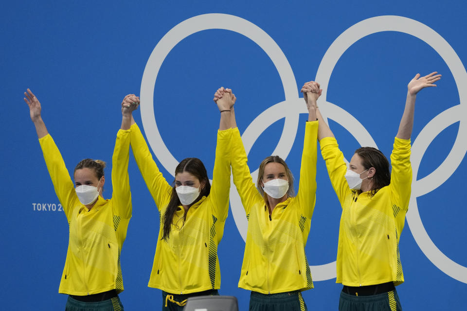 Australia's women's 4x100m women's relay team, Meg Harris, Bronte Campbell, Emma McKeon and Cate Campbell celebrate on the podium at the 2020 Summer Olympics, Sunday, July 25, 2021, in Tokyo, Japan. (AP Photo/Petr David Josek)