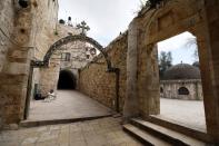 A general view shows a man resting next to one of the Stations of the Cross along the Via Dolorosa, amid the coronavirus disease (COVID-19) outbreak in Jerusalem's Old City