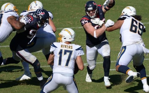 Houston Texans defensive end J.J. Watt (99) works against Los Angeles Chargers offensive tackle Sam Tevi (69) as he rushes quarterback Philip Rivers (17) during the third quarter at Dignity Health Sports Park - Credit: USA Today