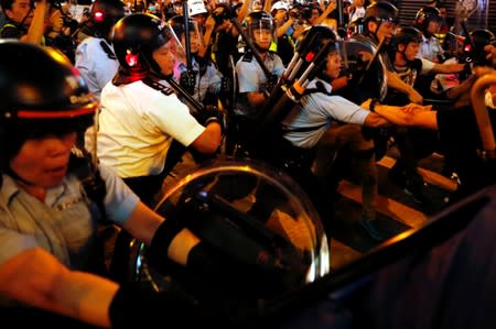 Riot police try to disperse anti-extradition bill protesters after a march at Hong Kong’s tourism district Nathan Road near Mongkok
