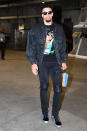 <p>Dillon Brooks dons an Off-White printed t-shirt under a dark wash jean jacket and blue and silver Chanel velvet sneakers ahead of the Grizzlies, Clippers game on March 31. </p>