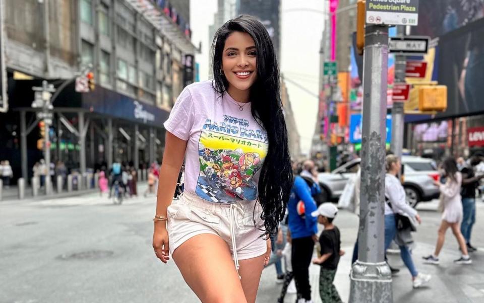 An Instagram image of Landy Párraga in Times Square, New York, wearing shorts and a T shirt
