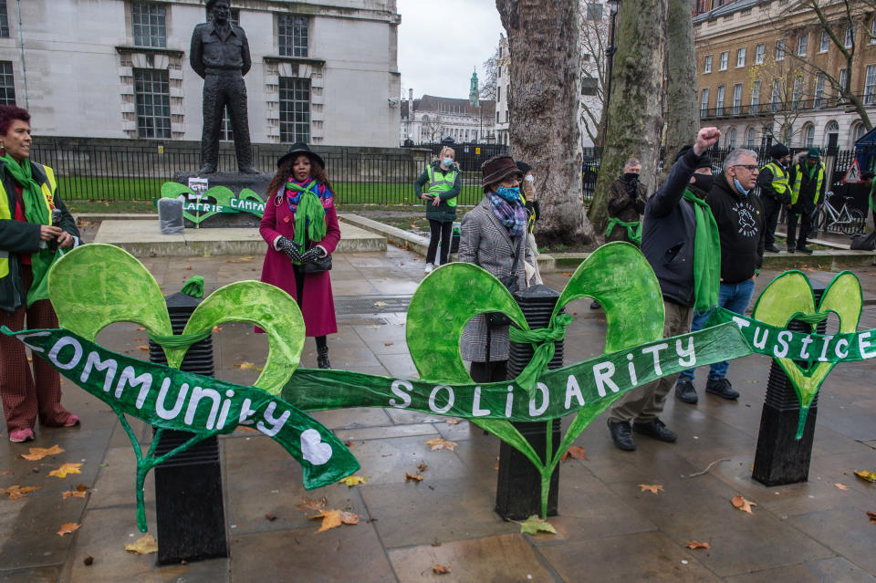 Grenfell survivors and their supporters protest at Downing street on December 14, 2020 in London, England. The protesters urged the French government to waive a law reportedly invoked by executives at Arconic, whose French division made the aluminium sheeting blamed in the Grenfell blaze, to avoid testifying before the UK inquiry. The French statute prohibits people from disclosing commercial information in foreign legal proceedings. The 2017 tower-block fire killed 72 people and led to a multiyear public inquiry now in its second phase. (Photo by Guy Smallman/Getty Images)