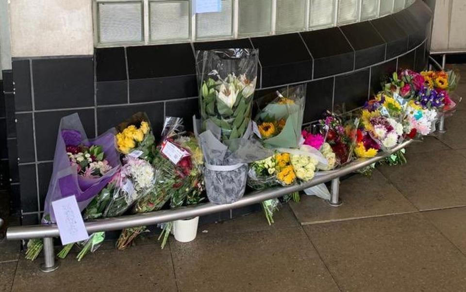 Flowers outside Perivale Tesco, Greenford, where 87-year-old Thomas O’Halloran who was fatally stabbed used to play his accordion (Ronaldo Butrus/PA) (PA Media)