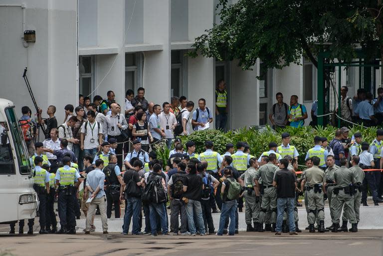 Hong Kong police carry out crowd control drills at a local police college in Hong Kong on June 25, 2014 ahead of planned July 1 protests