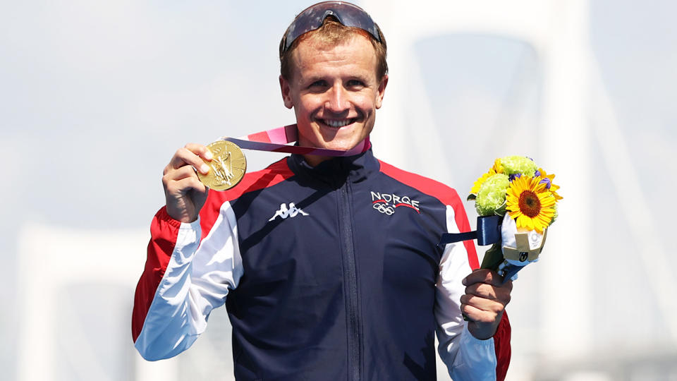 Kristian Blummenfelt, pictured here celebrating with the gold medal after winning the Olympics triathlon.