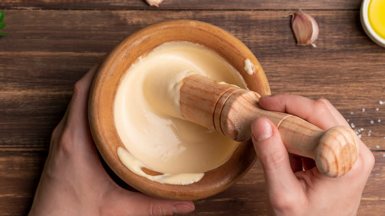 Making aioli in a bowl 