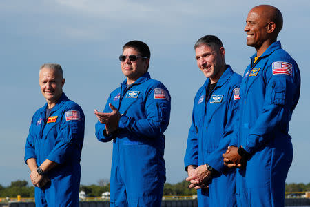 NASA commercial crew astronauts ( L to R ) Doug Hurley, Bob Behnken, Mike Hopkins and Victor Glover speak to the media prior to the launch of a SpaceX Falcon 9 carrying the Crew Dragon spacecraft on an uncrewed test flight to the International Space Station from the Kennedy Space Center in Cape Canaveral, Florida, U.S., March 1, 2019. REUTERS/Mike Blake