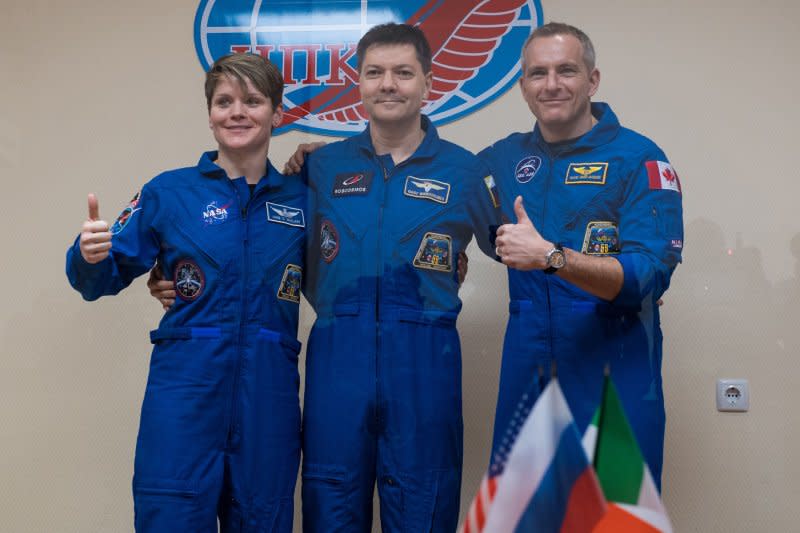 International Space Station Expedition 58 prime crew members, left to right, Flight Engineer Anne McClain of NASA, Soyuz Commander Oleg Kononenko of Roscosmos, and Flight Engineer David Saint-Jacques of the Canadian Space Agency (CSA) pose for a photo at the conclusion of a press conference, on December 2, 2018, at the Cosmonaut Hotel in Baikonur, Kazakhstan. Kononenko has spent more time in space than any other cosmonaut or astronaut. File NASA Photo by Aubrey Gemignani/UPI