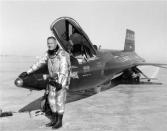 Neil Armstrong poses with an X-15 aircraft at the Dryden Flight Research Center in California, in this undated handout photo courtesy of NASA.