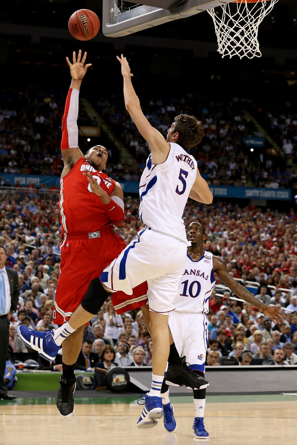 NEW ORLEANS, LA - MARCH 31: Jared Sullinger #0 of the Ohio State Buckeyes shoots over Jeff Withey #5 of the Kansas Jayhawks in the first half during the National Semifinal game of the 2012 NCAA Division I Men's Basketball Championship at the Mercedes-Benz Superdome on March 31, 2012 in New Orleans, Louisiana. (Photo by Jeff Gross/Getty Images)