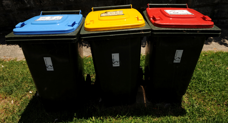 Three household bins in a row.