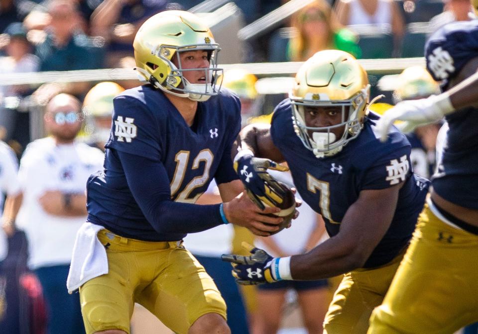 Tyler Buchner of Notre Dame (12) is likely to return as the starter for the TaxSlayer Gator Bowl on Dec. 30 against South Carolina. He started the first two games before a shoulder injury.