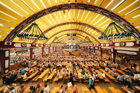 The interior of Loewenbraeu brewery's festive tent at Oktoberfest in Munich in 2016 - Credit: istock