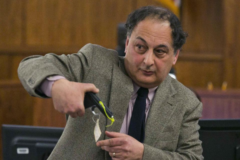 Attorney James Sultan shows a .22 caliber gun during the murder trial of former NFL player Aaron Hernandez at the Bristol County Superior Court in Fall River, Massachusetts, March 3, 2015. REUTERS/Dominick Reuter (UNITED STATES - Tags: CRIME LAW SPORT FOOTBALL)