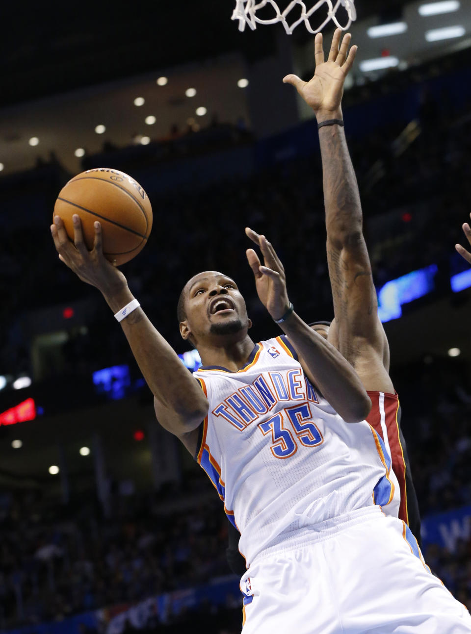 Oklahoma City Thunder forward Kevin Durant (35) shoots in front of Miami Heat forward LeBron James during the fourth quarter of an NBA basketball game in Oklahoma City, Thursday, Feb. 20, 2014. Miami won 103-81. (AP Photo/Sue Ogrocki)