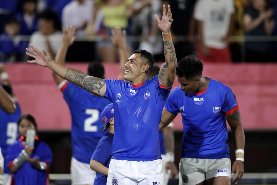 Samoa's Tusi Pisi waves to the crowd following their Rugby World Cup Pool A game against Russia at Kumagaya Rugby Stadium, Kumagaya City, Japan, Tuesday, Sept. 24, 2019. Samoa defeated Russia 34-9. (AP Photo/Jae Hong)