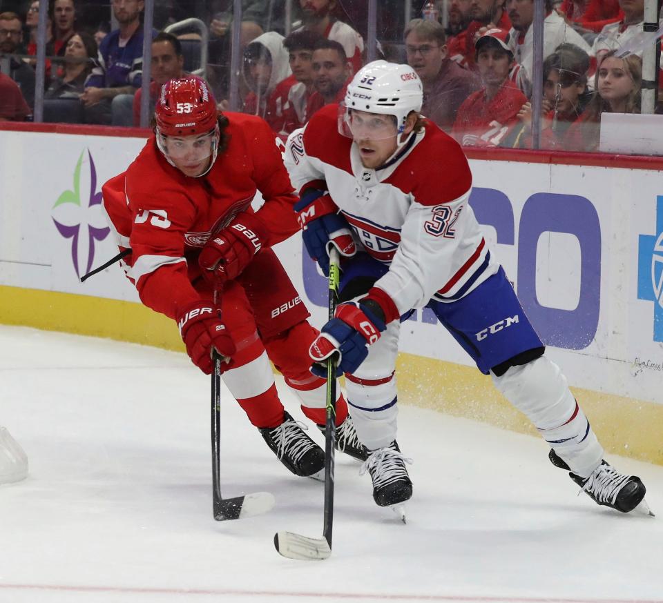 Detroit Red Wings defenseman Moritz Seider (53) defends against Montreal Canadiens center Rem Pitlick (32) during second period action at Little Caesars Arena Friday, October 14, 2022.