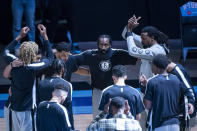 Brooklyn Nets guard James Harden (13) looks up from the Nets huddle before the first half of an NBA basketball game against the Houston Rockets Wednesday, March 3, 2021, in Houston. (Mark Mulligan/Houston Chronicle via AP)