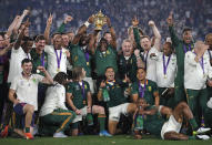 South African captain Siya Kolisi holds the Webb Ellis Cup aloft with South African President Cyril Ramaphosa after South Africa defeated England to win the Rugby World Cup final at International Yokohama Stadium in Yokohama, Japan, Saturday, Nov. 2, 2019. (AP Photo/Christophe Ena)