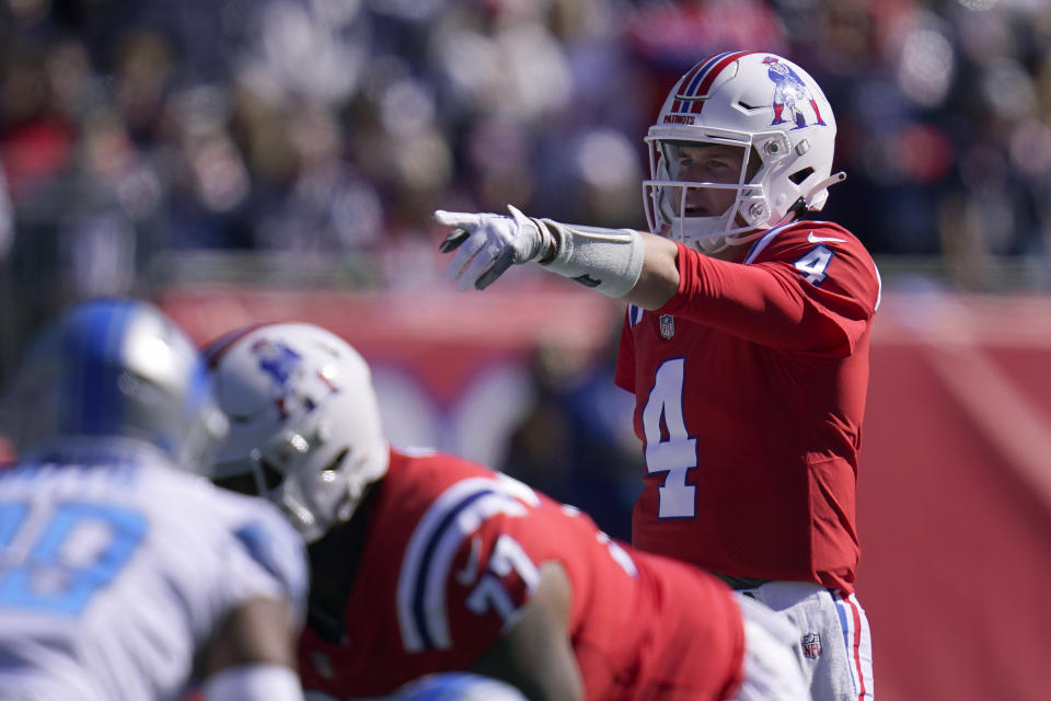 New England Patriots quarterback Bailey Zappe (4) gestures during the first half of an NFL football game against the Detroit Lions, Sunday, Oct. 9, 2022, in Foxborough, Mass. (AP Photo/Michael Dwyer)