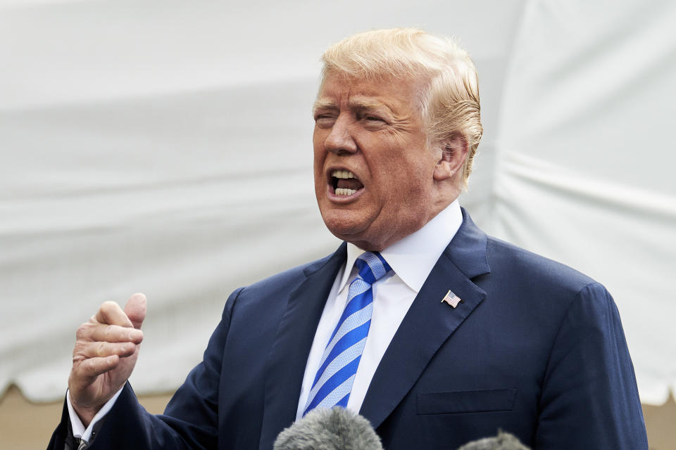 President Trump speaks to reporters before departing the White House in Washington, D.C., on Friday. (T.J. Kirkpatrick/Bloomberg via Getty Images)