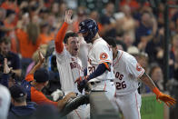 Houston Astros' Chas McCormick (20) is congratulated by Alex Bregman, left, and Jose Siri (26) after hitting a home run against the Arizona Diamondbacks during the eighth inning of a baseball game Sunday, Sept. 19, 2021, in Houston. (AP Photo/David J. Phillip)