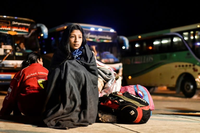 Nacari, 16, awaits in Huaquillas, Ecuador, border with Peru, after travelling across the country in a bus provided by Ecuadoran authorities as part of a "humanitarian corridor" for Venezuelans fleeing their country's economic crisis on August 25, 2018