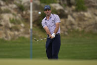 Denny McCarthy hits to the 13th green during the third round of the Texas Open golf tournament Saturday, April 6, 2024, in San Antonio. (AP Photo/Eric Gay)