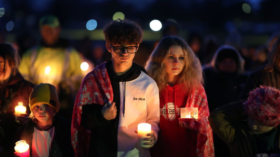 Community members gather for a candlelight vigil Thursday night. - Scott Olson/Getty Images