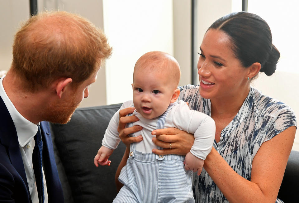 CAPE TOWN, SOUTH AFRICA - SEPTEMBER 25: Prince Harry, Duke of Sussex and Meghan, Duchess of Sussex tend to their baby son Archie Mountbatten-Windsor at a meeting with Archbishop Desmond Tutu at the Desmond & Leah Tutu Legacy Foundation during their royal tour of South Africa on September 25, 2019 in Cape Town, South Africa. (Photo by Toby Melville - Pool/Getty Images)