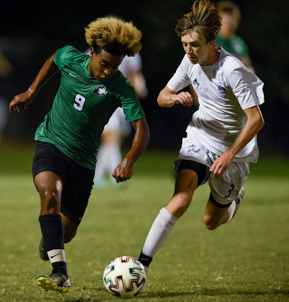 North's Abrham Lucht (9) dribbles the ball in front of Castle's Max McConnell (3) at North High School in Evansville, Ind., Tuesday, Aug. 31, 2021.