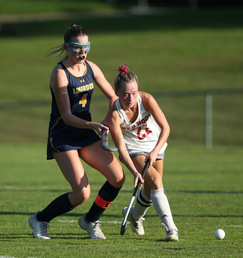 Red Hook's Maddie Boyd gains possession against Lourdes during an Oct. 3, 2023 field hockey game.