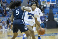 Memphis guard Jamirah Shutes (23) drives defended by Connecticut guard Christyn Williams (5) in the first half of an NCAA college basketball game Tuesday, Jan. 14, 2020, in Memphis, Tenn. (AP Photo/Nikki Boertman)