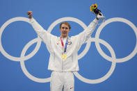 Gold medalist Chase Kalisz celebrates on the podium after winning the men's 400-meter individual medley at the 2020 Summer Olympics, Sunday, July 25, 2021, in Tokyo, Japan. (AP Photo/Matthias Schrader)