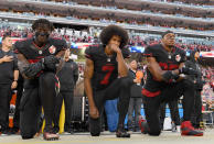 Eli Harold #58, Colin Kaepernick #7, and Eric Reid #35 of the San Francisco 49ers kneel in protest during the national anthem prior to their NFL game against the Arizona Cardinals at Levi's Stadium on October 6, 2016 in Santa Clara, California. (Photo by Thearon W. Henderson/Getty Images)