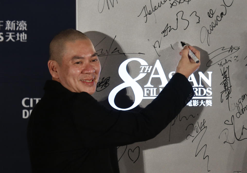 Taiwanese director Tsai Ming Liang poses on the red carpet of the Asian Film Awards in Macau Thursday, March 27, 2014. (AP Photo/Kin Cheung)