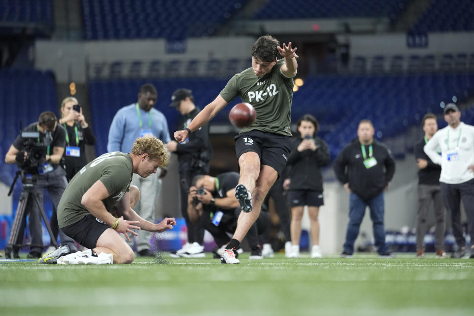 FILE - Kicker Charlie Smyth of Ireland runs a drill at the NFL football scouting combine, Sunday, March 3, 2024, in Indianapolis. Ireland has become part of the NFL’s international playbook as Irish interest in the sport increases. Dublin is under review to potentially join the league’s growing list of international cities hosting a regular-season game. (AP Photo/Michael Conroy, File)