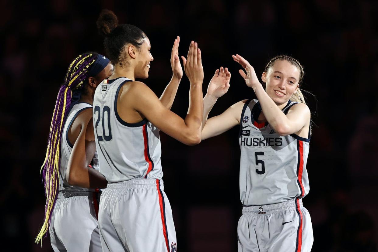 <span class="caption">College basketball player Paige Bueckers, right, of the Connecticut Huskies, has over 900,000 followers on Instagram as of September 2021.</span> <span class="attribution"><a class="link " href="https://www.gettyimages.com/detail/news-photo/paige-bueckers-of-the-uconn-huskies-during-intros-prior-to-news-photo/1310523087" rel="nofollow noopener" target="_blank" data-ylk="slk:Elsa/Getty Images;elm:context_link;itc:0;sec:content-canvas"> Elsa/Getty Images</a></span>