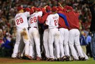 Roy Halladay is mobbed by teammates after pitching a no-hitter and the win in Game 1 of the NLDS in 2010.