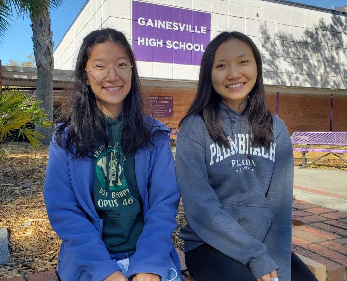 Vicki Jung, junior at Gainesville High School (left) and Rachel Young, senior at Gainesville High School (right). Jung earned Top of the USA score on the Cambridge Mathematics exam and Young Top of World score in the English Language Cambridge Exam. 
Photo Courtesy of Alachua County Public Schools