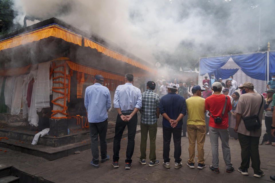 Friends and family members gather during the funeral of famed American extreme skier Hilaree Nelson in Kathmandu, Nepal, Sunday, Oct.2, 2022. Nelson had died last week on Mount Manaslu while coming down from the top of the summit the 8,163-meter (26,775-foot) world's eighth-highest mountain. (AP Photo/Niranjan Shrestha)