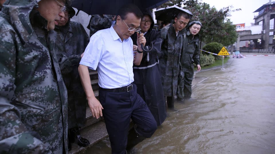 Chinese Premier Li Keqiang visits the Yangtze River embankment in the central city of Wuhan in July 2016 after a deadly flood that killed more than 100 people and left scores missing in the region. - AFP/Getty Images