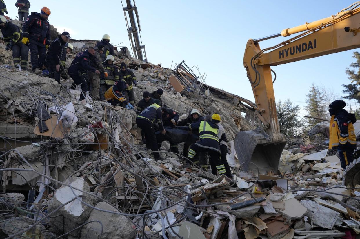 Rescuers work at a collapsed building in southeastern Turkey. <a href="https://newsroom.ap.org/detail/TurkeySyriaEarthquakePhotoGallery/1bf8c21596934bfb97a74eca9bfc30ae/photo" rel="nofollow noopener" target="_blank" data-ylk="slk:AP Photo/Kamran Jebreili;elm:context_link;itc:0;sec:content-canvas" class="link ">AP Photo/Kamran Jebreili</a>