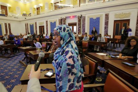 Laila Jama, a high school student from the City on a Hill Charter Public School, casts her vote while playing the role of a U.S. senator working to pass an immigration reform bill during a mock legislative session of the U.S. Senate chamber at the Edward M. Kennedy Institute in Boston, Massachusetts June 10, 2015. REUTERS/Brian Snyder