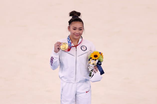 Sunisa Lee of the U.S. poses with her gold medal after winning the women's all-around gymnastics final at the Tokyo Games on July 29. (Photo: Laurence Griffiths via Getty Images)