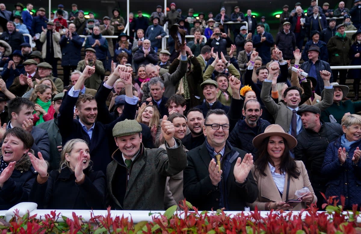 Crowds enjoy watching a race during day three of the Cheltenham Festival, when attendance was down several thousand on last year (David Davies for The Jockey Club/PA Wire)