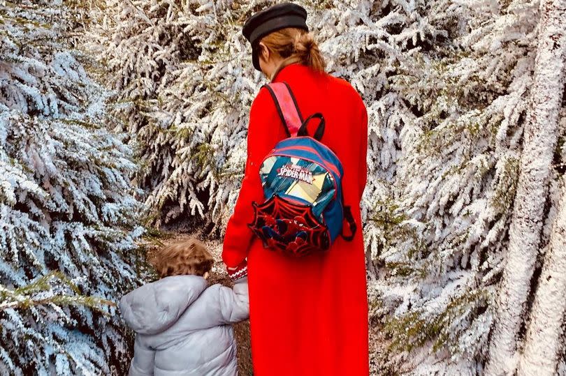 Bear, 7, holds hands with his mum Cheryl