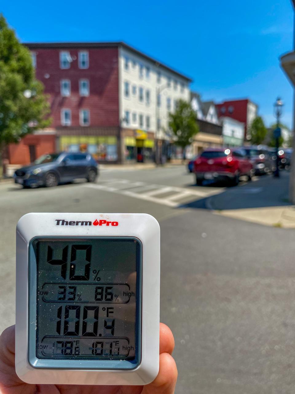 On Pleasant Street in the Flint neighborhood of Fall River, the air temperature reads 100.4 degrees.